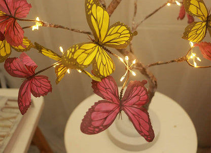 Tischlampe mit Baum-LED im Schmetterlingsdesign