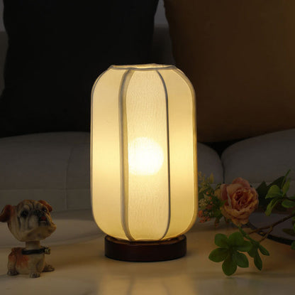 Traditioneller chinesischer Stoffzylinder-Schirm Holzfuß 1-Licht Tischlampe für Schlafzimmer