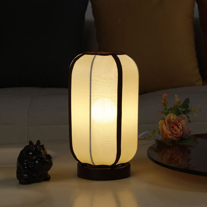 Traditioneller chinesischer Stoffzylinder-Schirm Holzfuß 1-Licht Tischlampe für Schlafzimmer