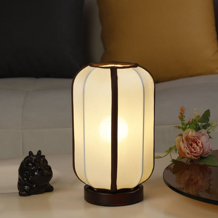 Traditioneller chinesischer Stoffzylinder-Schirm Holzfuß 1-Licht Tischlampe für Schlafzimmer